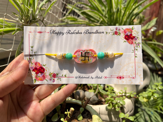 Floral Resin Rakhi - Swastik